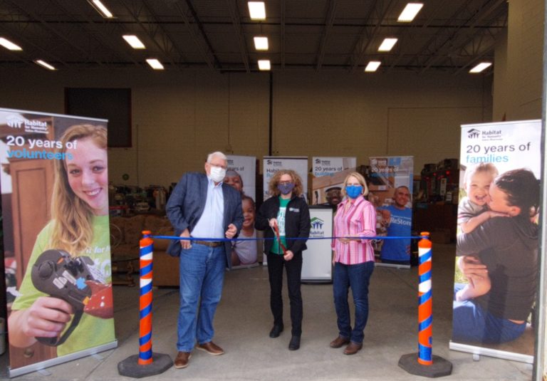 Orangeville Mayor Sandy Brown, Habitat HMD CEO Eden Grodzinski, and MPP Sylvia Brown cut the ribbon at the Orangeville ReStore relaunch last November 23rd, 2021.