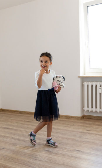 Child looking at new home